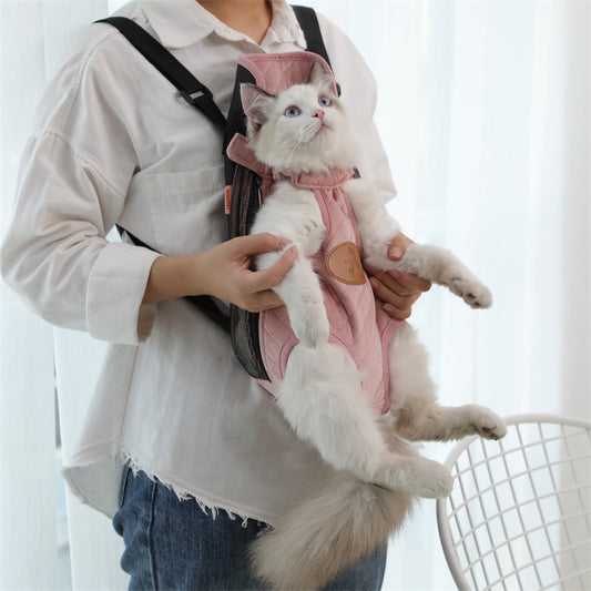 Beige quilted pet carrier backpack with black adjustable straps, featuring leg and tail openings for small cats or dogs.