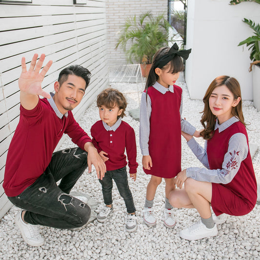 Family of four in matching maroon and striped outfits, including father, mother, son, and daughter.