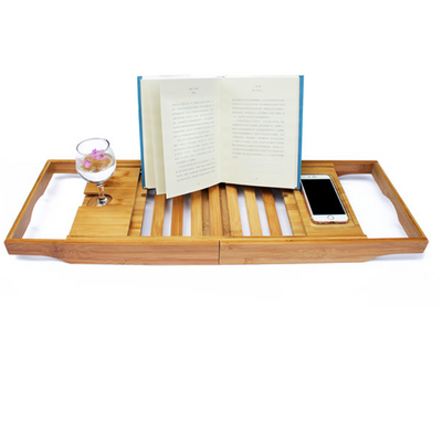 Bamboo bathtub caddy with an adjustable book stand, slotted tray, and compartments for bath essentials.