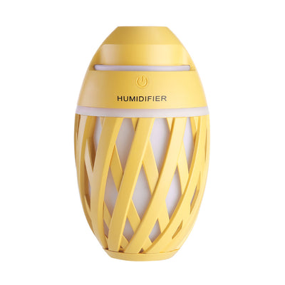 Light green football-shaped humidifier with a decorative lattice pattern and a power button on top. - Image 22