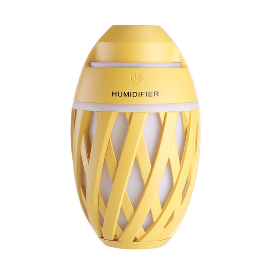 Light green football-shaped humidifier with a decorative lattice pattern and a power button on top. - Image 22