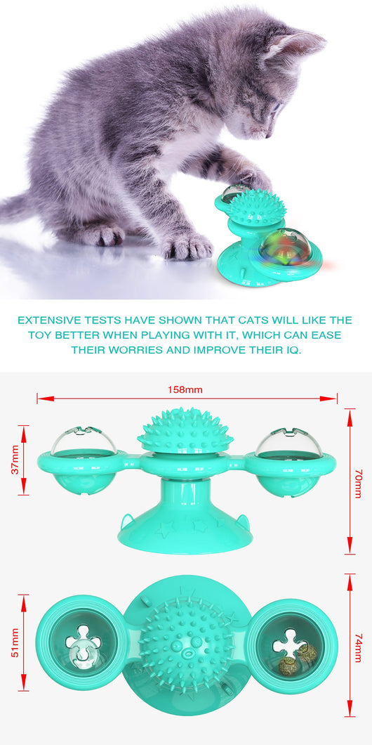 Gray tabby cat playing with a teal windmill cat toy featuring a suction cup base, textured ball, and colorful spinning paddles. - Image 19