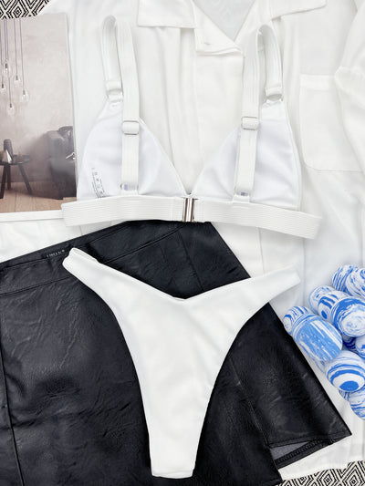 Coral ribbed two-piece bikini with triangle top and O-ring detail on straps and sides, worn by a woman. - Image 26