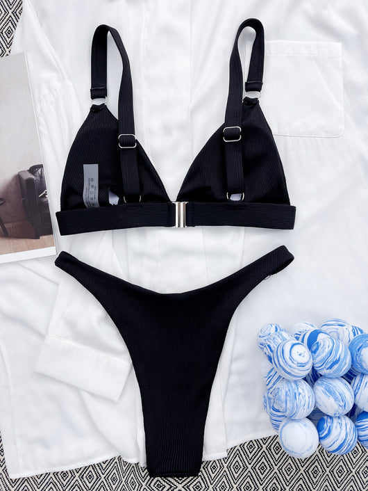 Coral ribbed two-piece bikini with triangle top and O-ring detail on straps and sides, worn by a woman. - Image 28