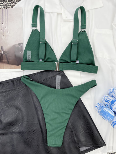 Coral ribbed two-piece bikini with triangle top and O-ring detail on straps and sides, worn by a woman. - Image 32