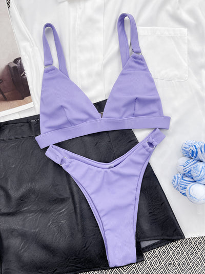 Coral ribbed two-piece bikini with triangle top and O-ring detail on straps and sides, worn by a woman. - Image 35