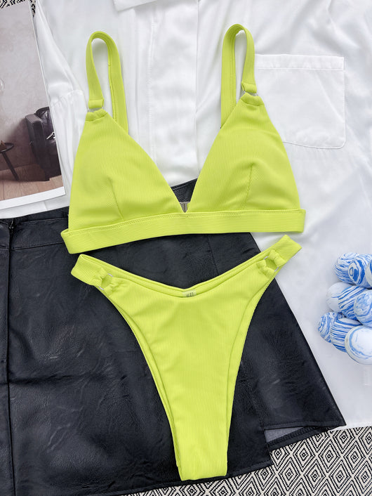 Coral ribbed two-piece bikini with triangle top and O-ring detail on straps and sides, worn by a woman. - Image 37