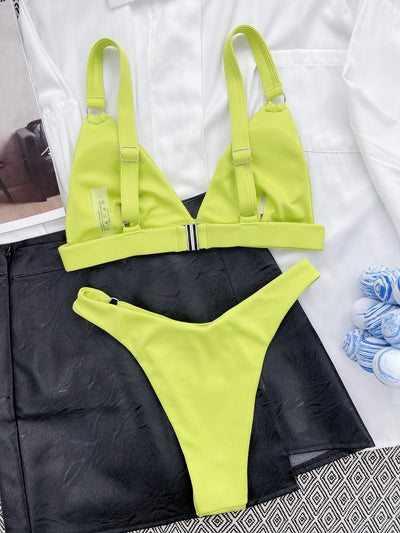 Coral ribbed two-piece bikini with triangle top and O-ring detail on straps and sides, worn by a woman. - Image 38