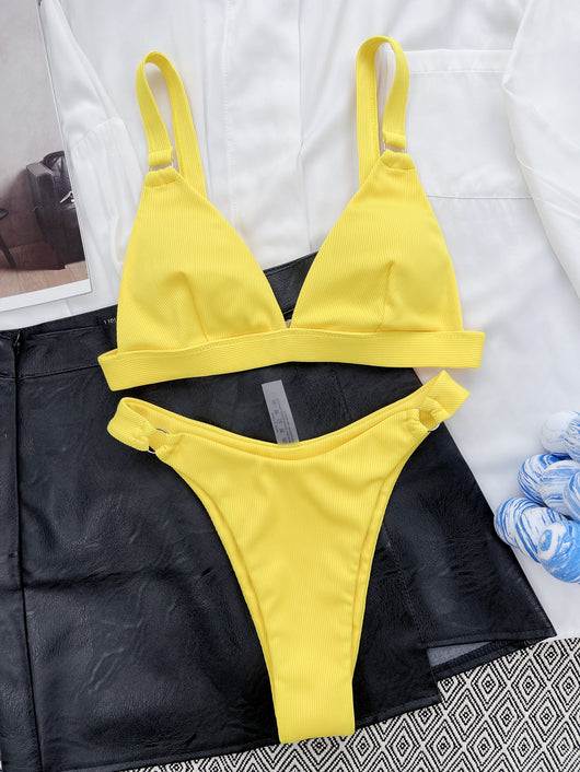 Coral ribbed two-piece bikini with triangle top and O-ring detail on straps and sides, worn by a woman. - Image 41
