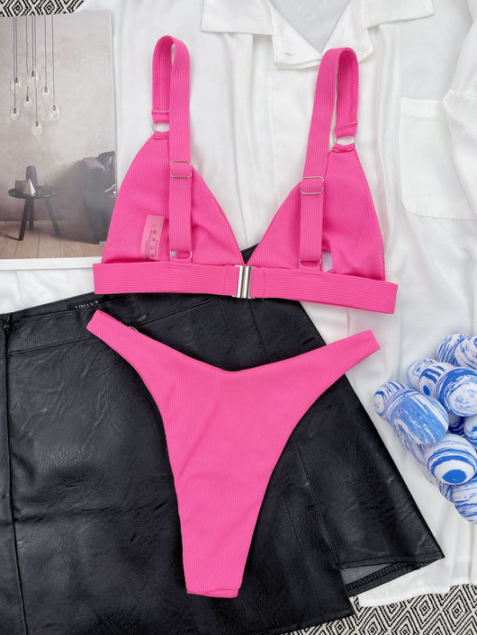 Coral ribbed two-piece bikini with triangle top and O-ring detail on straps and sides, worn by a woman. - Image 44