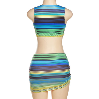 Women's green, blue, and yellow striped two-piece set with a V-neck crop top and an asymmetrical mini skirt. - Image 14