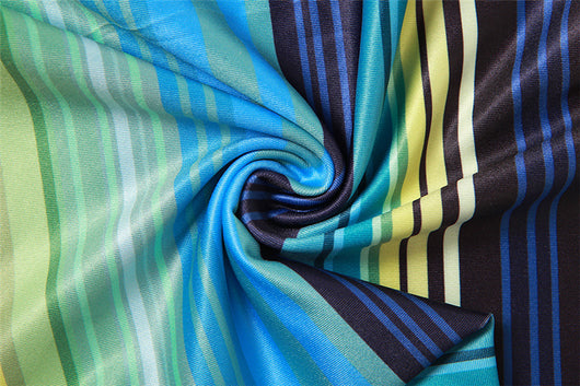 Women's green, blue, and yellow striped two-piece set with a V-neck crop top and an asymmetrical mini skirt. - Image 22