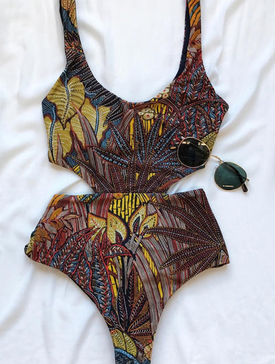 One-piece swimsuit with a vibrant tropical leaf print in yellow, brown, and blue, featuring stylish side cut-outs. - Image 11
