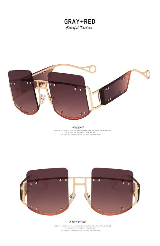 Red oversized rimless sunglasses with a unique geometric design and gold-tone metal temples. - Image 12