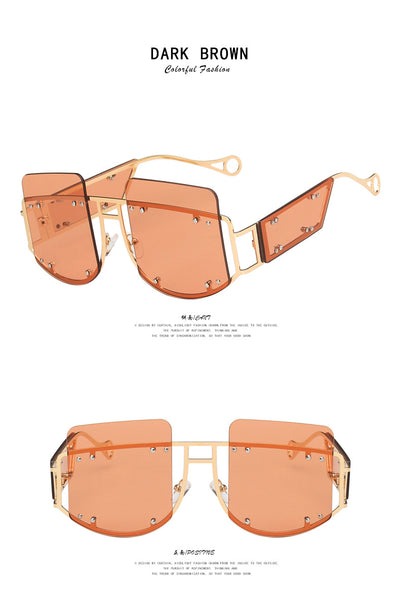 Red oversized rimless sunglasses with a unique geometric design and gold-tone metal temples. - Image 13