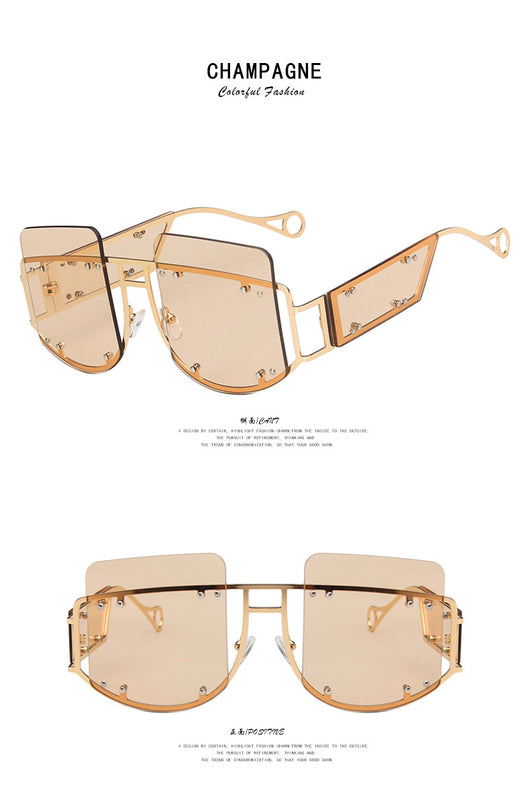 Red oversized rimless sunglasses with a unique geometric design and gold-tone metal temples. - Image 14