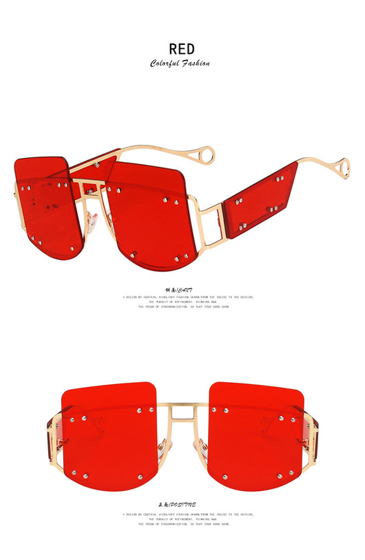 Red oversized rimless sunglasses with a unique geometric design and gold-tone metal temples. - Image 16