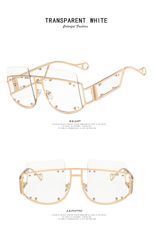 Red oversized rimless sunglasses with a unique geometric design and gold-tone metal temples. - Image 17