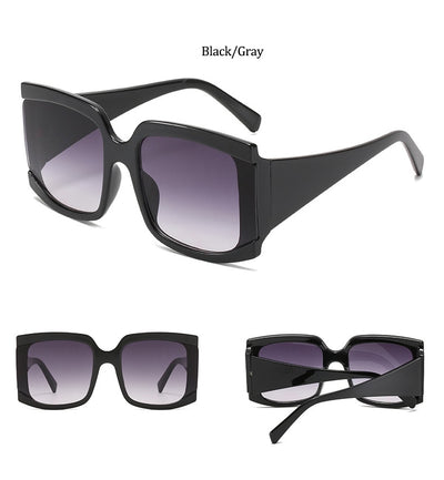 Oversized square-frame sunglasses with a light pink frame and gradient lenses transitioning from purple to orange to yellow. - Image 18