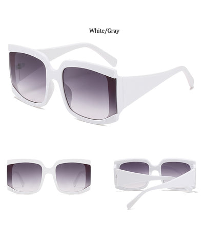 Oversized square-frame sunglasses with a light pink frame and gradient lenses transitioning from purple to orange to yellow. - Image 24