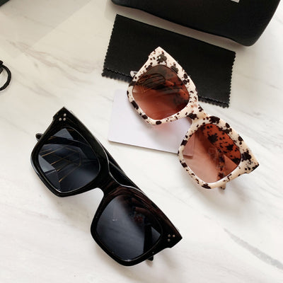 Retro oversized square sunglasses with a dark red frame and pink gradient lenses, held by a hand. - Image 8