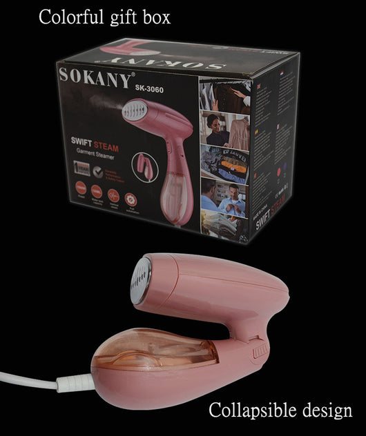 Pink handheld garment steamer with a clear water tank, silver soleplate, and a detachable brush attachment. - Image 17