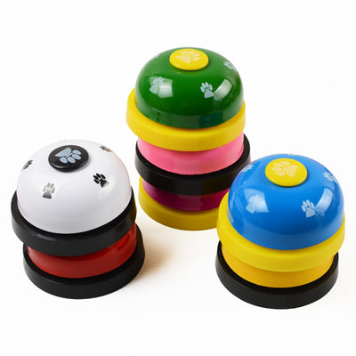 Blue and yellow pet training bell with white paw print designs and a large yellow button on top. - Image 17