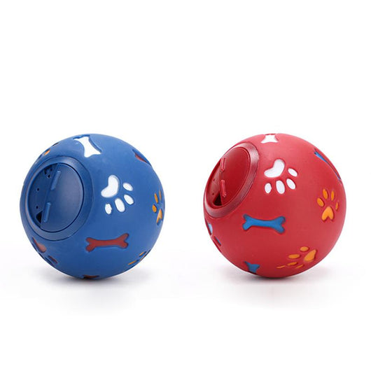 Red rubber pet puzzle ball with white, blue, and orange paw print and bone cutouts, featuring a treat dispenser opening. - Image 10