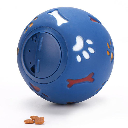 Red rubber pet puzzle ball with white, blue, and orange paw print and bone cutouts, featuring a treat dispenser opening. - Image 12