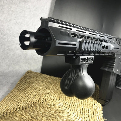 Black water bomb toy grip with a unique, anatomical shape and a rail mount for toy guns. - Image 10