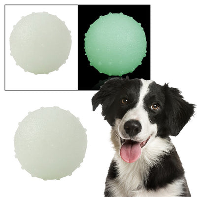 Interactive pet glow ball, off-white in daylight and glowing green in the evening, with a textured surface. - Image 6