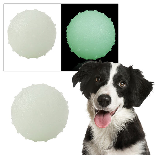 Interactive pet glow ball, off-white in daylight and glowing green in the evening, with a textured surface. - Image 6