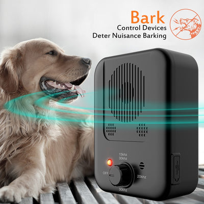 Black ultrasonic anti-barking device with a red light and a control knob, next to yellow pet goggles with rainbow lenses. - Image 29