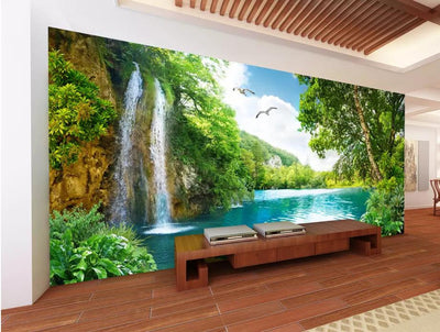 3D wallpaper mural depicting a vibrant landscape with a waterfall, blue lake, lush green trees, and flying birds. - Image 6
