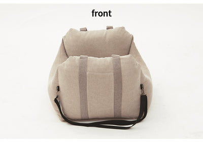 Beige pet car carrier seat with tan straps and a separate red pet seatbelt leash for safe car travel. - Image 22