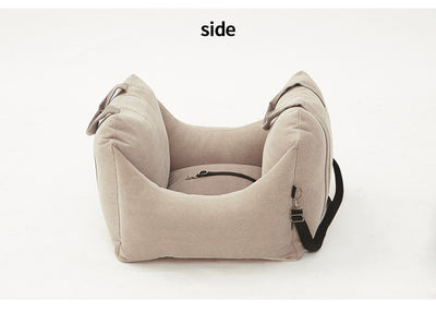 Beige pet car carrier seat with tan straps and a separate red pet seatbelt leash for safe car travel. - Image 23