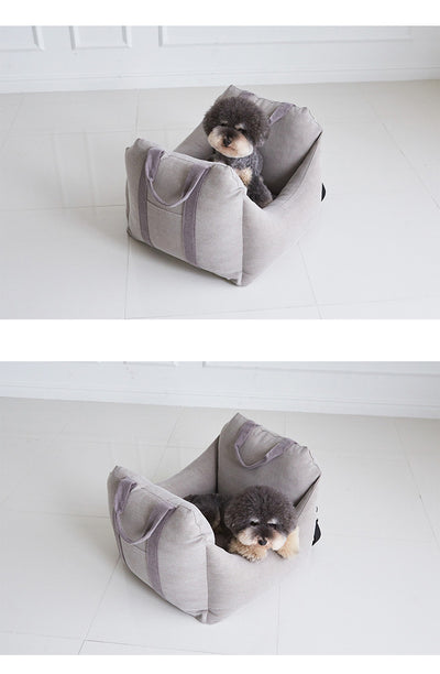 Beige pet car carrier seat with tan straps and a separate red pet seatbelt leash for safe car travel. - Image 28