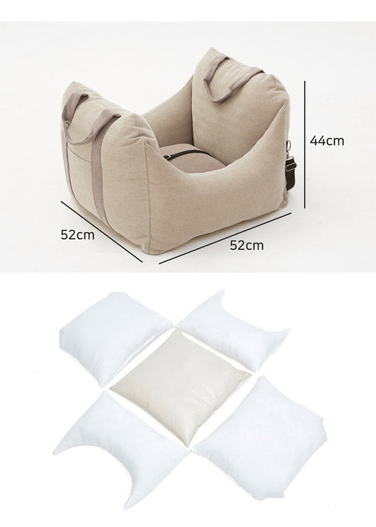 Beige pet car carrier seat with tan straps and a separate red pet seatbelt leash for safe car travel. - Image 29