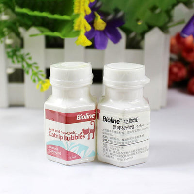 Bioline Catnip Bubbles bottle with a red label, featuring a cat silhouette and text "Safe and non-toxic. Natural Catnip oil 17.7ml". A white bubble wand is next - Image 11