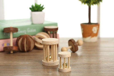 Set of natural wooden hamster toys including dumbbell shapes, a spherical bell toy, and two cylindrical bell toys, with a hamster. - Image 24