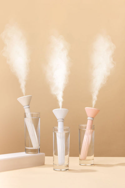 Beige and white USB ultrasonic humidifier with a fluted conical top and a cylindrical body with a water level window. - Image 17