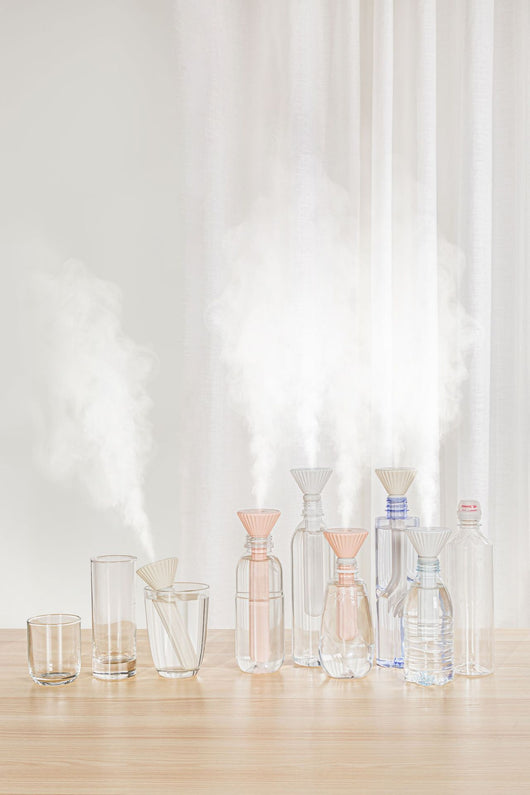 Beige and white USB ultrasonic humidifier with a fluted conical top and a cylindrical body with a water level window. - Image 24