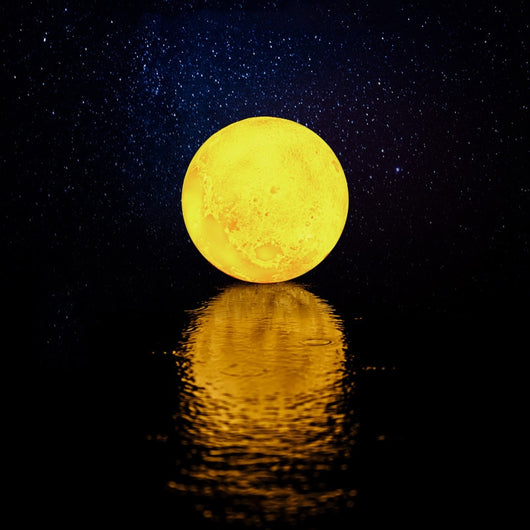 Moon-shaped night light and air humidifier on a wooden stand, emitting mist and a warm glow, with books and flowers. - Image 26