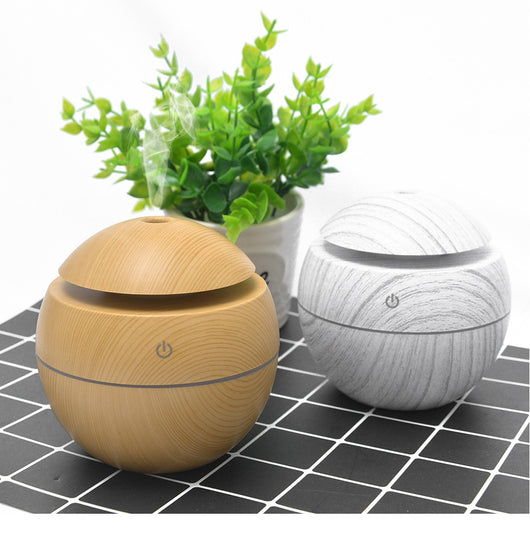 Black spherical ultrasonic atomizer with a power button icon, designed for aromatherapy and humidification. - Image 12