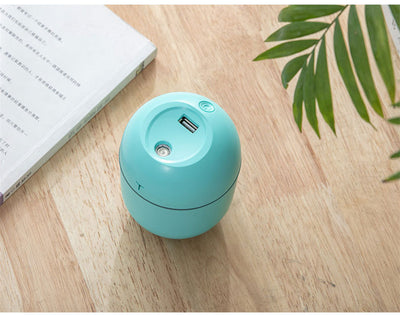 White egg-shaped mini USB humidifier with a 220ml capacity, featuring a subtle 'T' logo and grey accent line. - Image 11