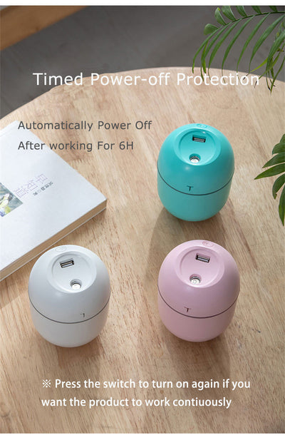 White egg-shaped mini USB humidifier with a 220ml capacity, featuring a subtle 'T' logo and grey accent line. - Image 13