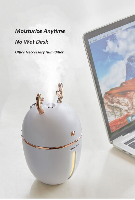 Pink deer-shaped ultrasonic humidifier with gold antlers, a white USB fan, and a white USB light. - Image 17
