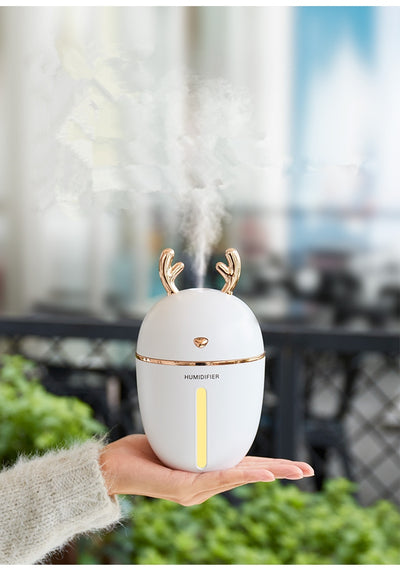 Pink deer-shaped ultrasonic humidifier with gold antlers, a white USB fan, and a white USB light. - Image 23