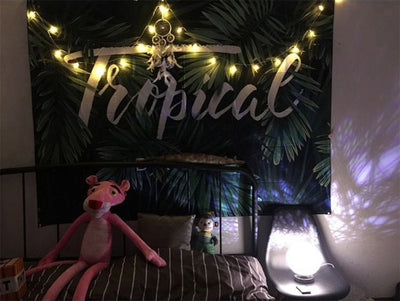Black tapestry with white constellations and a large grey moon hanging above a bed in a bedroom. - Image 20