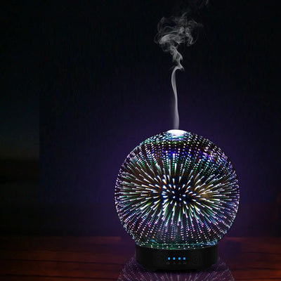 Spherical 3D aromatherapy essential oil diffuser with 7 LED color lighting modes and a black base. - Image 9